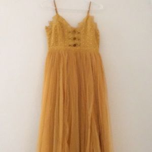 Long formal dress . Color: yellow Size: small Brand: INA